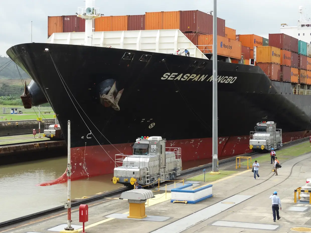 Container ship under tow at the Miraflores Locks, Panama Canal