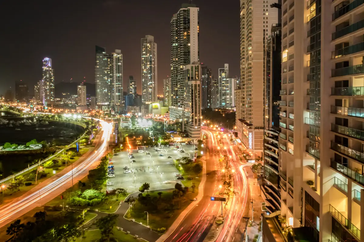 Panama City at night: lit avenue and high-rises
